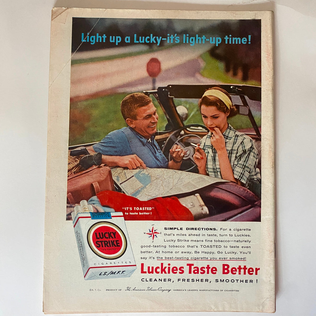 Back cover of VTG Time Magazine June 25, 1956, with an advertisement for Lucky Strike cigarettes, highlighting a cheerful couple enjoying a summer outing.