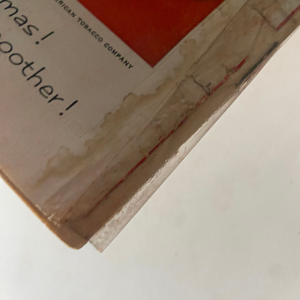 Close-up view of the back cover of VTG Time Magazine November 30, 1953, highlighting the bottom edge with visible wear and stained paper from the age of the publication.