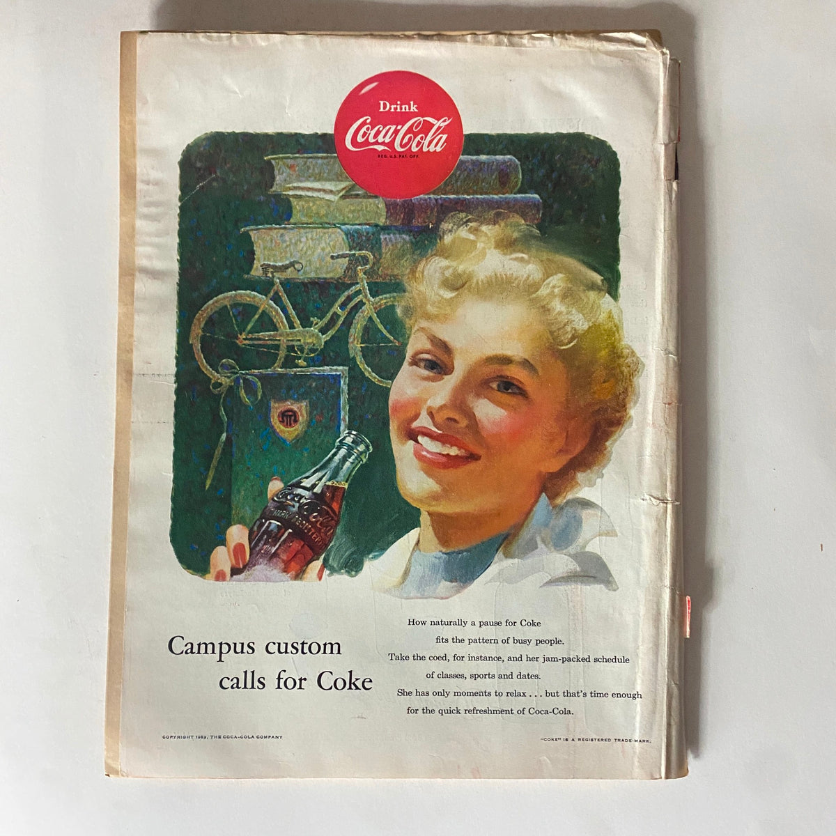Back cover of VTG Time Magazine from September 28, 1953, displaying a vintage Coca-Cola advertisement with a smiling woman holding a Coke bottle, emphasizing classic advertising styles of the era.