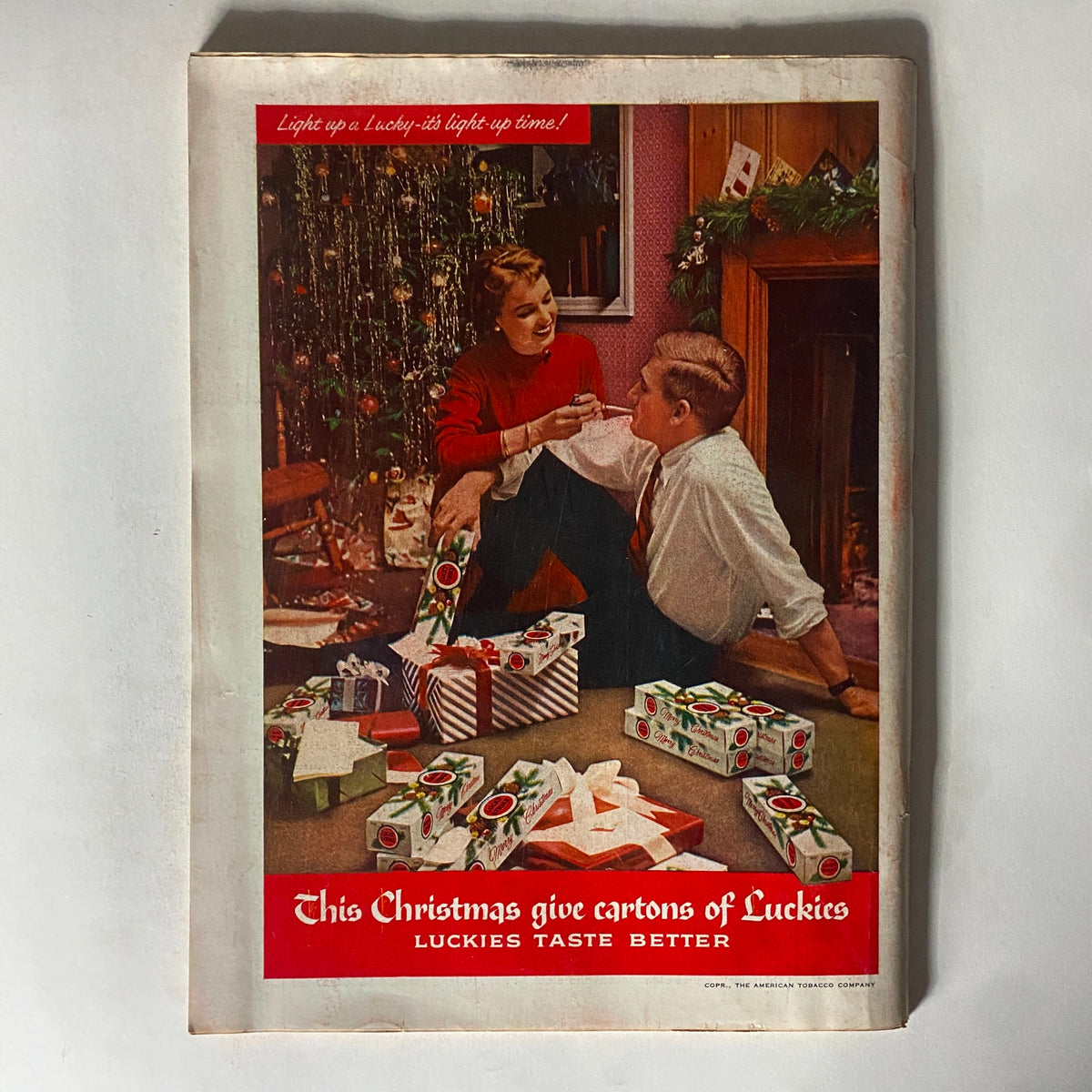 Vintage Time Magazine December 12, 1955, Volume 66, Number 24, featuring a nostalgic Christmas scene with a couple laughing by a decorated tree surrounded by gifts, highlighting toy culture and American holidays.