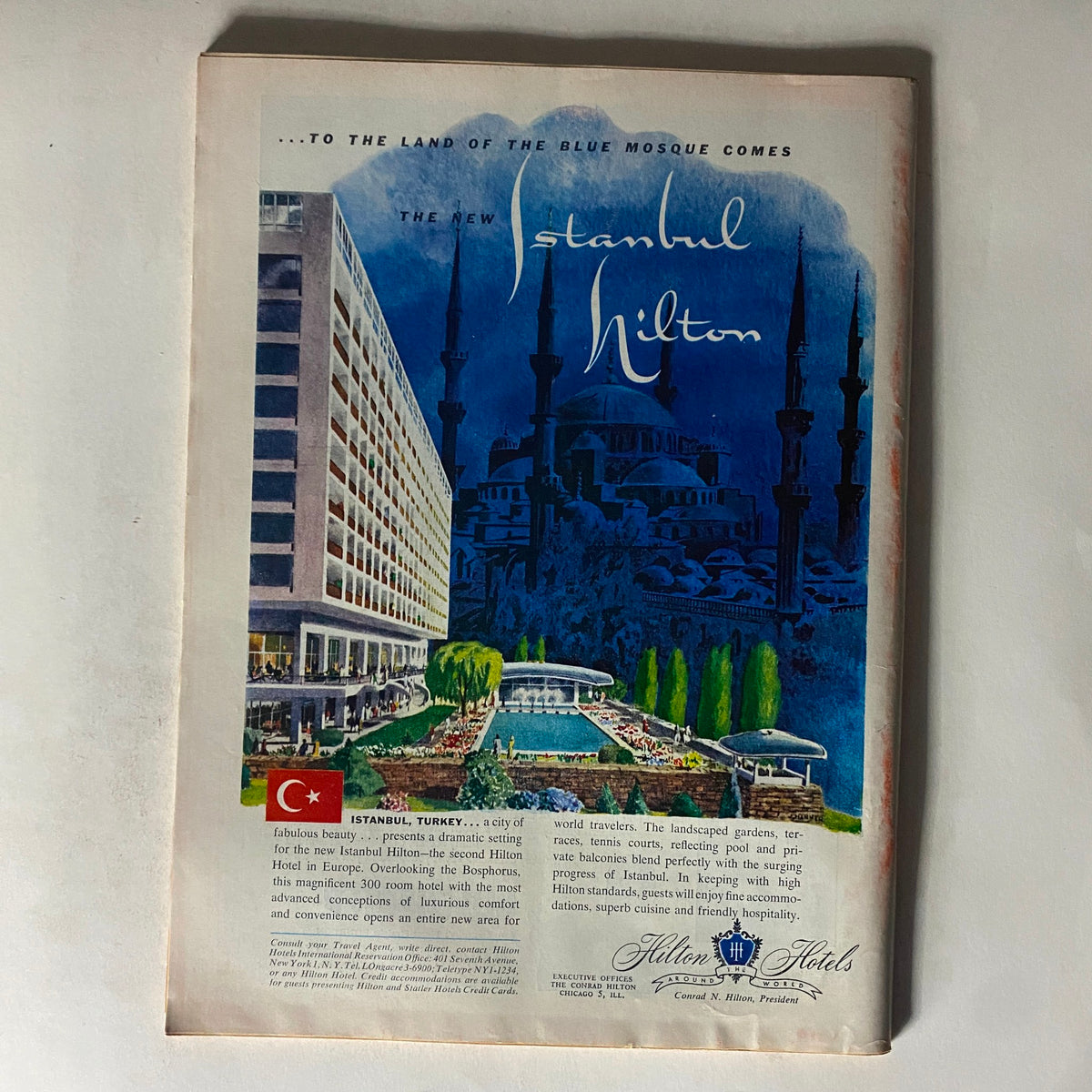 Advertisement page from VTG Time Magazine June 13, 1955 promoting the new Istanbul Hilton, featuring artistic design and highlighting luxury travel.