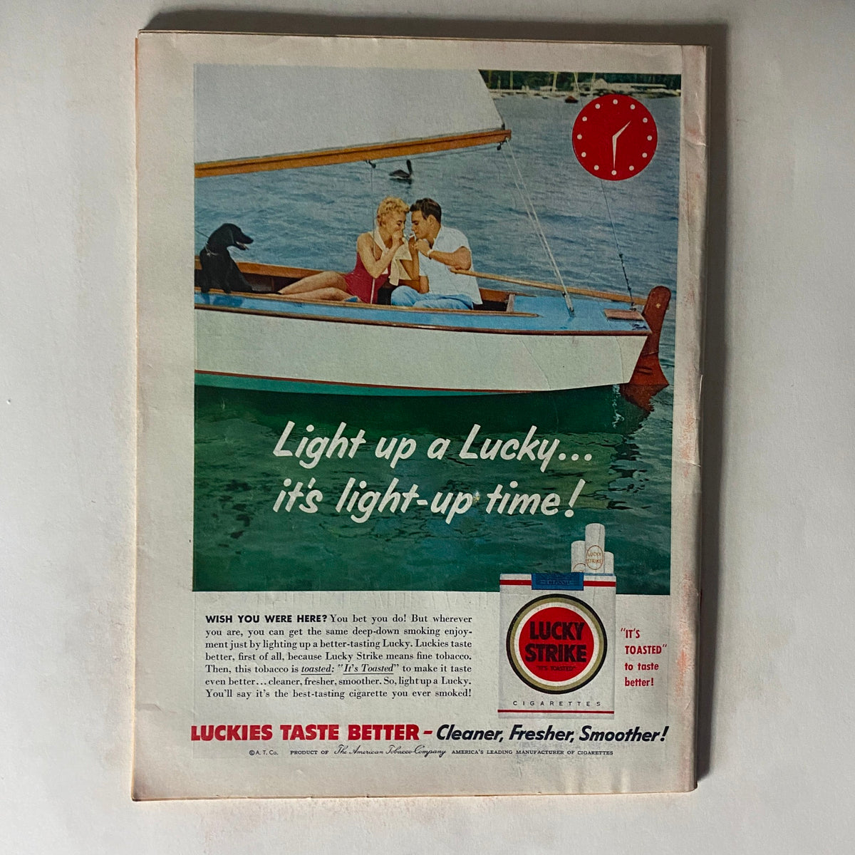 Vintage advertisement from VTG Time Magazine June 27, 1955 Vol 65 No. 26 promoting Lucky Strike cigarettes with a scenic boating illustration.