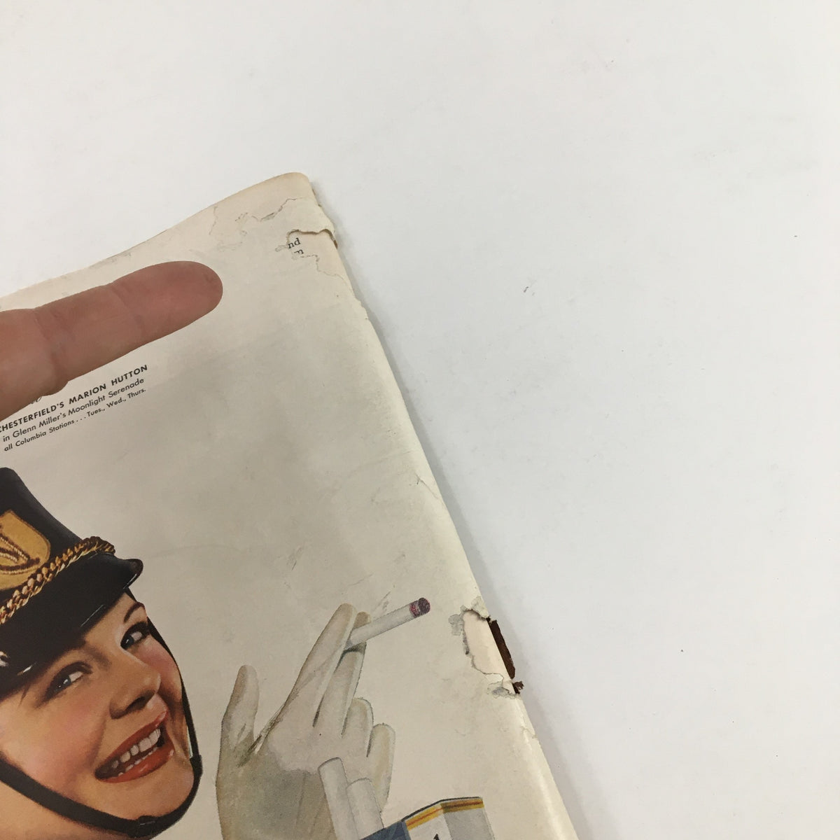 Close-up of the cover of Time Magazine June 24, 1940 featuring a vintage advertisement for Chesterfield cigarettes, showcasing a woman in a uniform holding a cigarette, highlighting the magazine's historical significance.