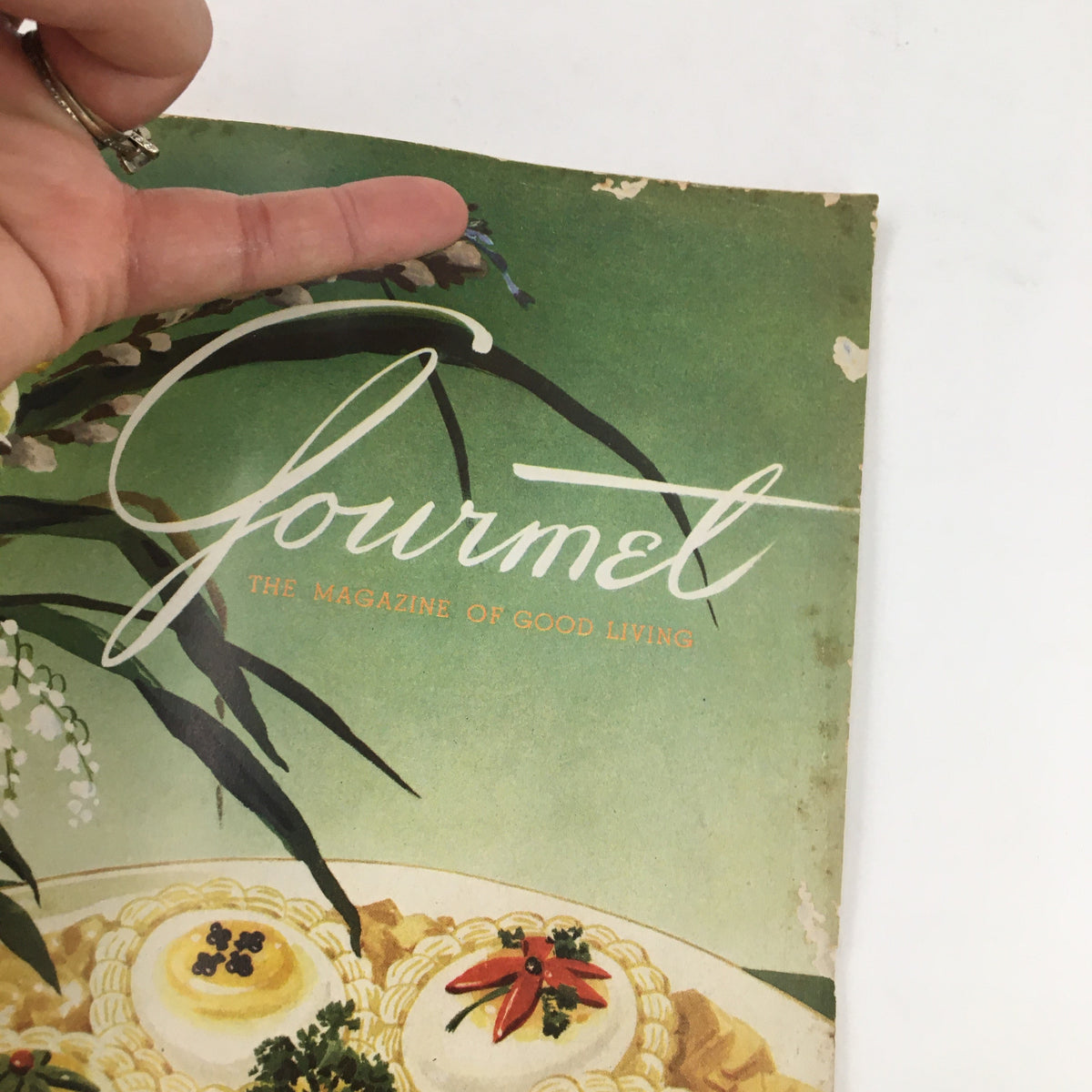 Close-up of the cover of Gourmet Magazine April 1953 Vol. 13 No. 4, highlighting the title and decorative elements.