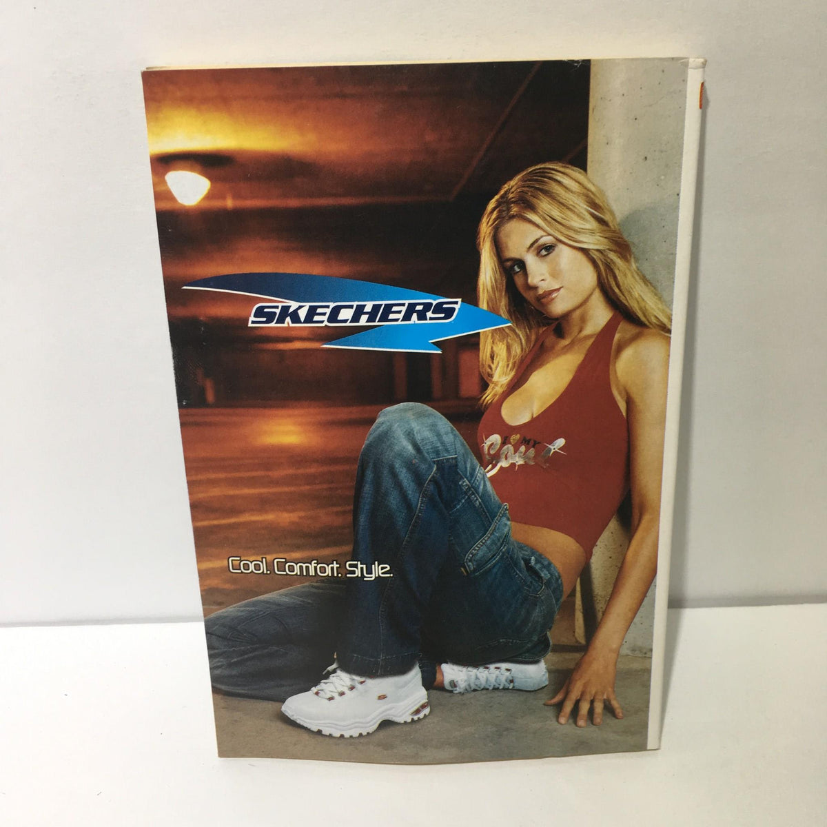 Promotional Skechers catalog featuring a model in casual attire, highlighting the brand's slogan 'Cool. Comfort. Style.' alongside fashion inspiration.