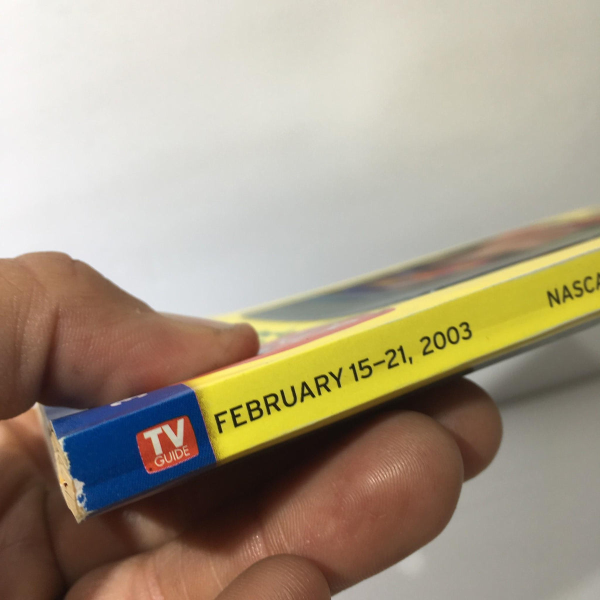 Side view of the TV Guide February 15-21 2003, highlighting the date and title text for Nascar All-Star '03.