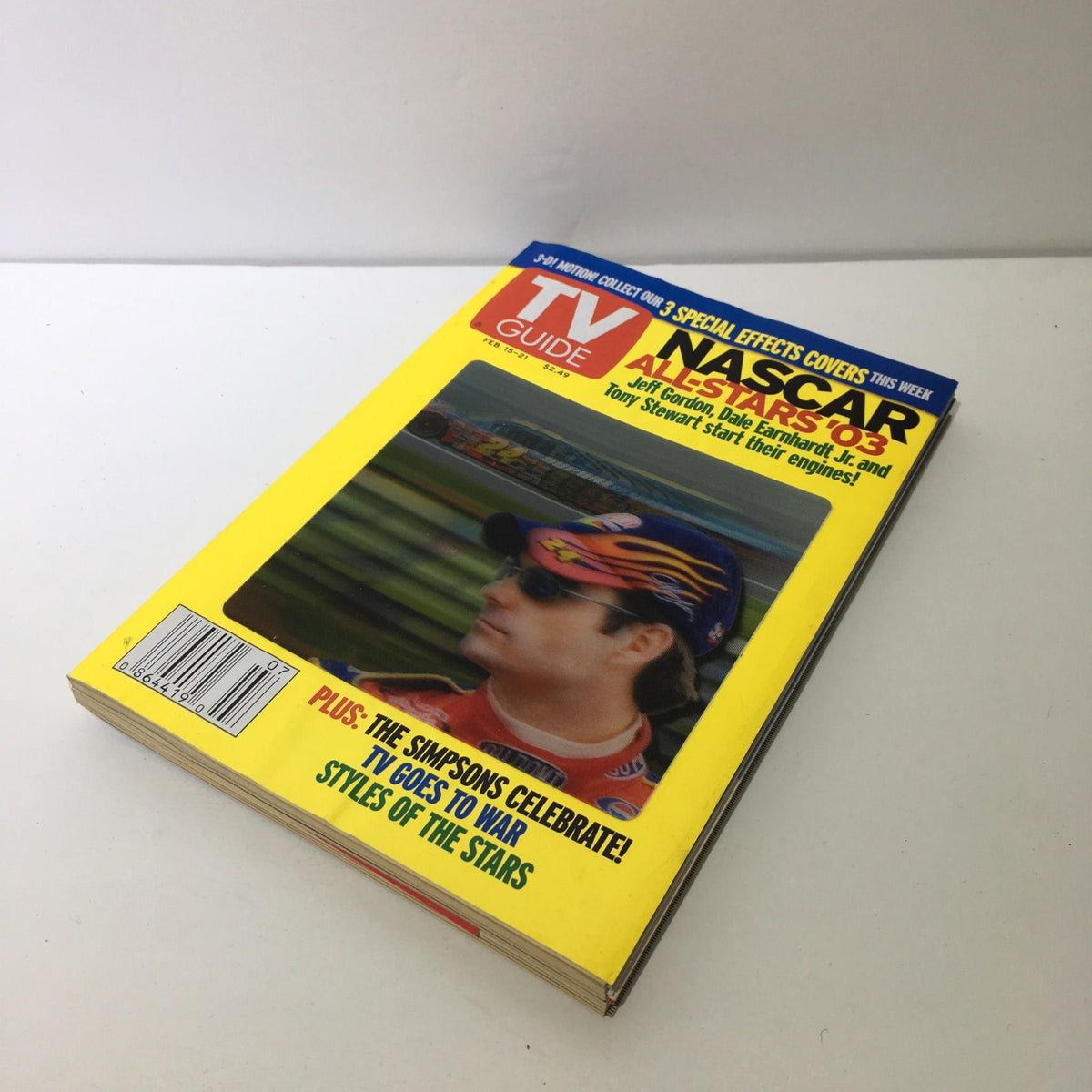 Cover of TV Guide from February 15-21, 2003 featuring NASCAR All-Star '03 with Jeff Gordon on the cover, displaying vibrant colors and information about the NASCAR racing event.