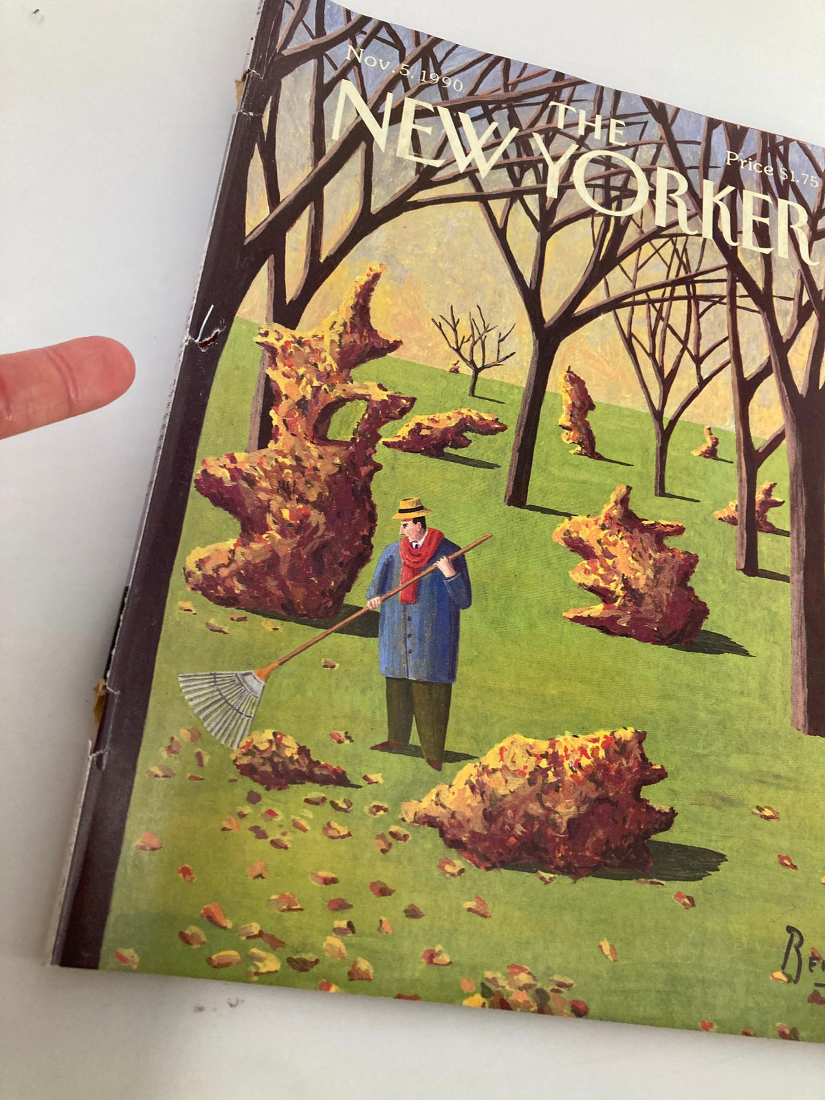 Close-up of The New Yorker magazine cover from November 5, 1990, displaying the 'Leave Sculpture' artwork by Benoit van Innis, depicting a man raking leaves in a park setting with abstract sculptures.