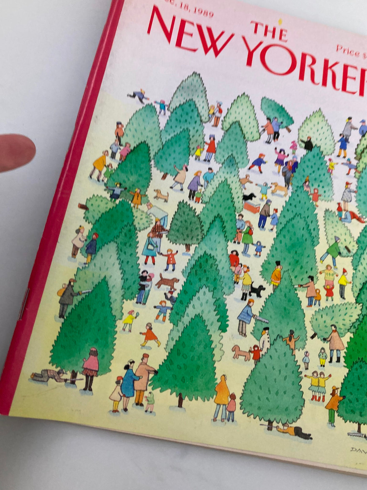 Close-up view of the cover of The New Yorker magazine December 18, 1989, highlighting the colorful scene of people in a tree lot illustration for the story 'Picking Trees' by Susan Davis.