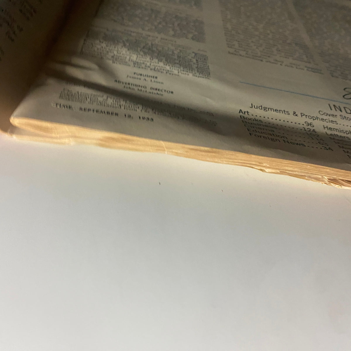 Close-up view of the spine of vintage Time Magazine from September 12, 1955, showing wear over time, highlighting its historical significance related to Space Surgeon John Stapp.