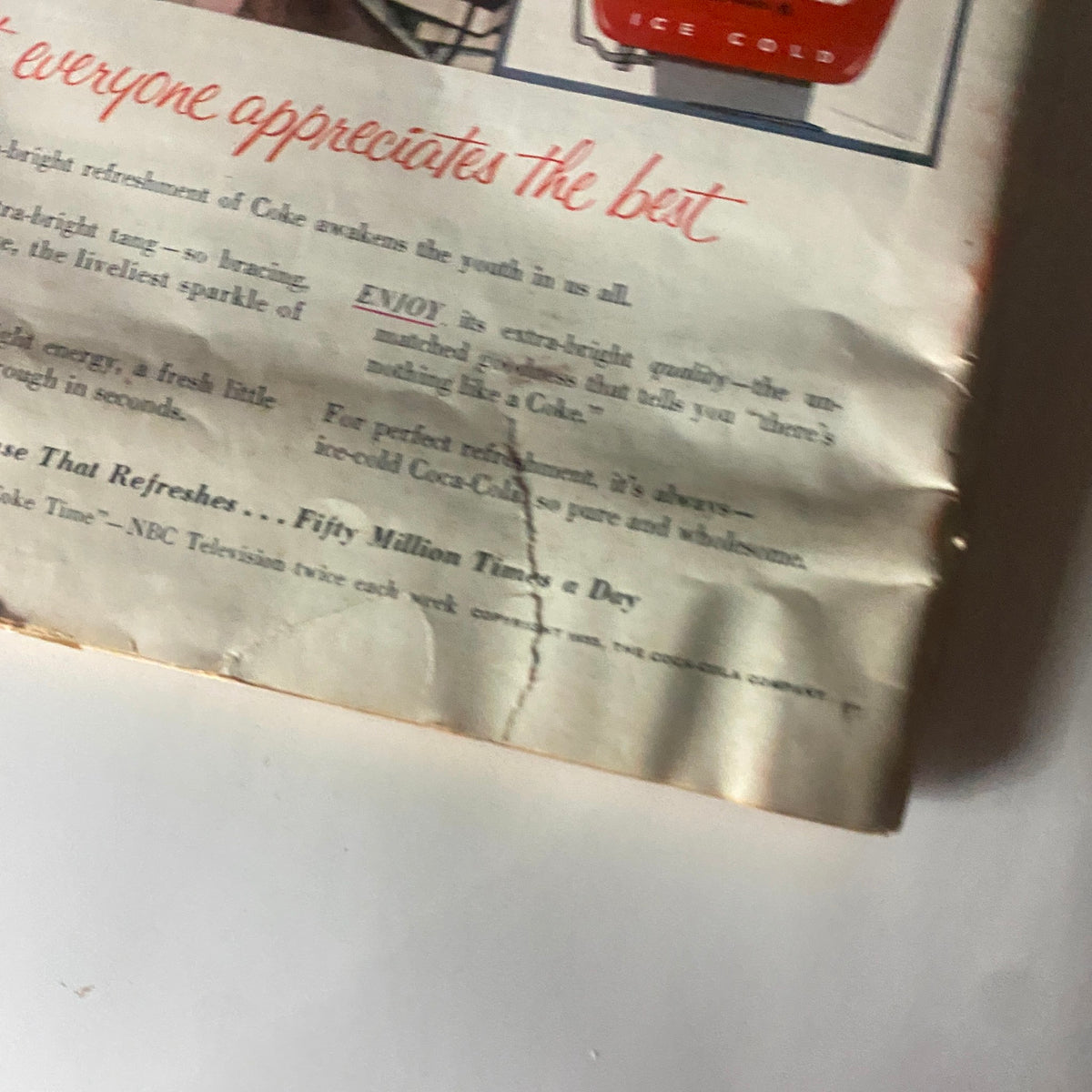 Detailed view of the Coca-Cola advertisement from vintage Time Magazine September 12, 1955, emphasizing vintage advertising style and branding.