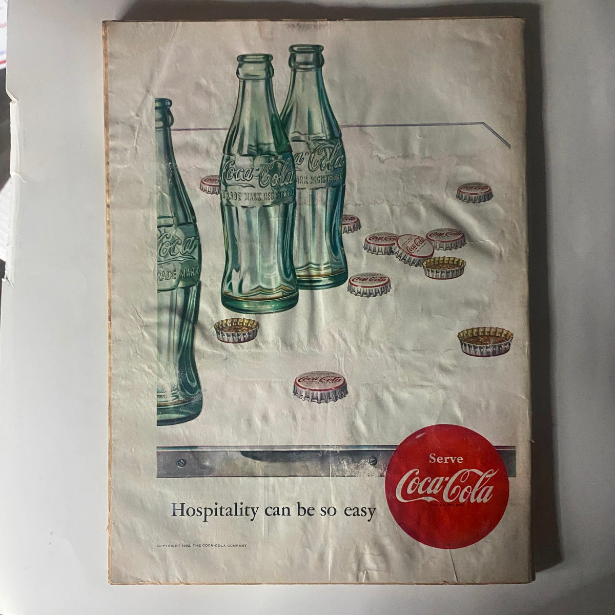 Back cover of VTG Time Magazine April 14, 1952 Vol 59 No. 15 showcasing a Coca-Cola advertisement with bottles and caps, promoting hospitality.