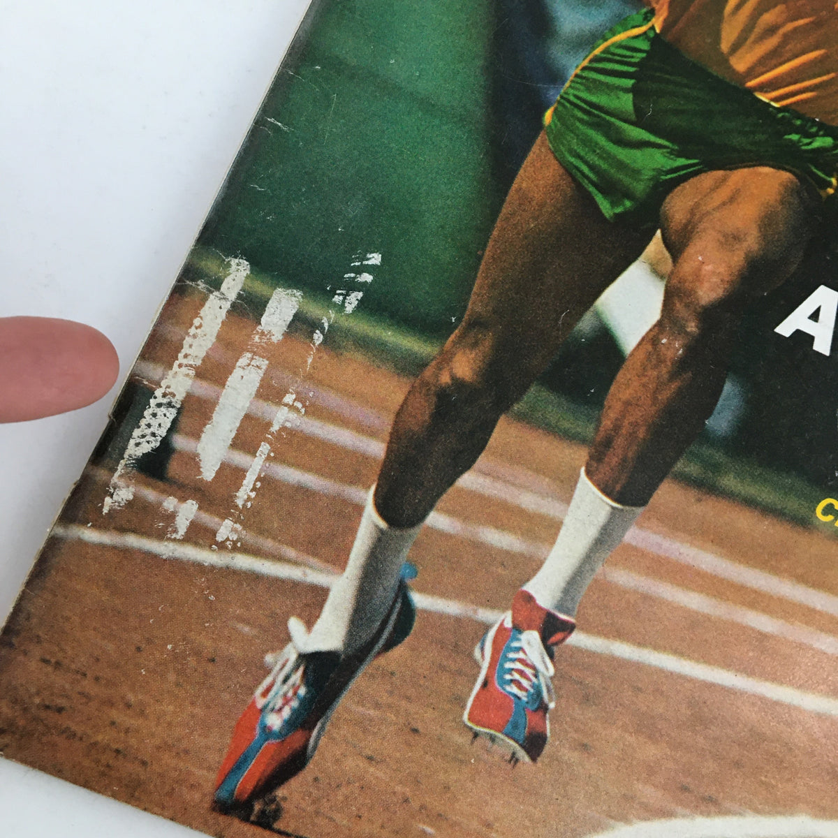 Close-up of the Newsweek Magazine July 15 1968 featuring champion Black sprinter Tommie Smith, showcasing his athletic shoes and part of the cover image, ideal for collectors and sports history enthusiasts.