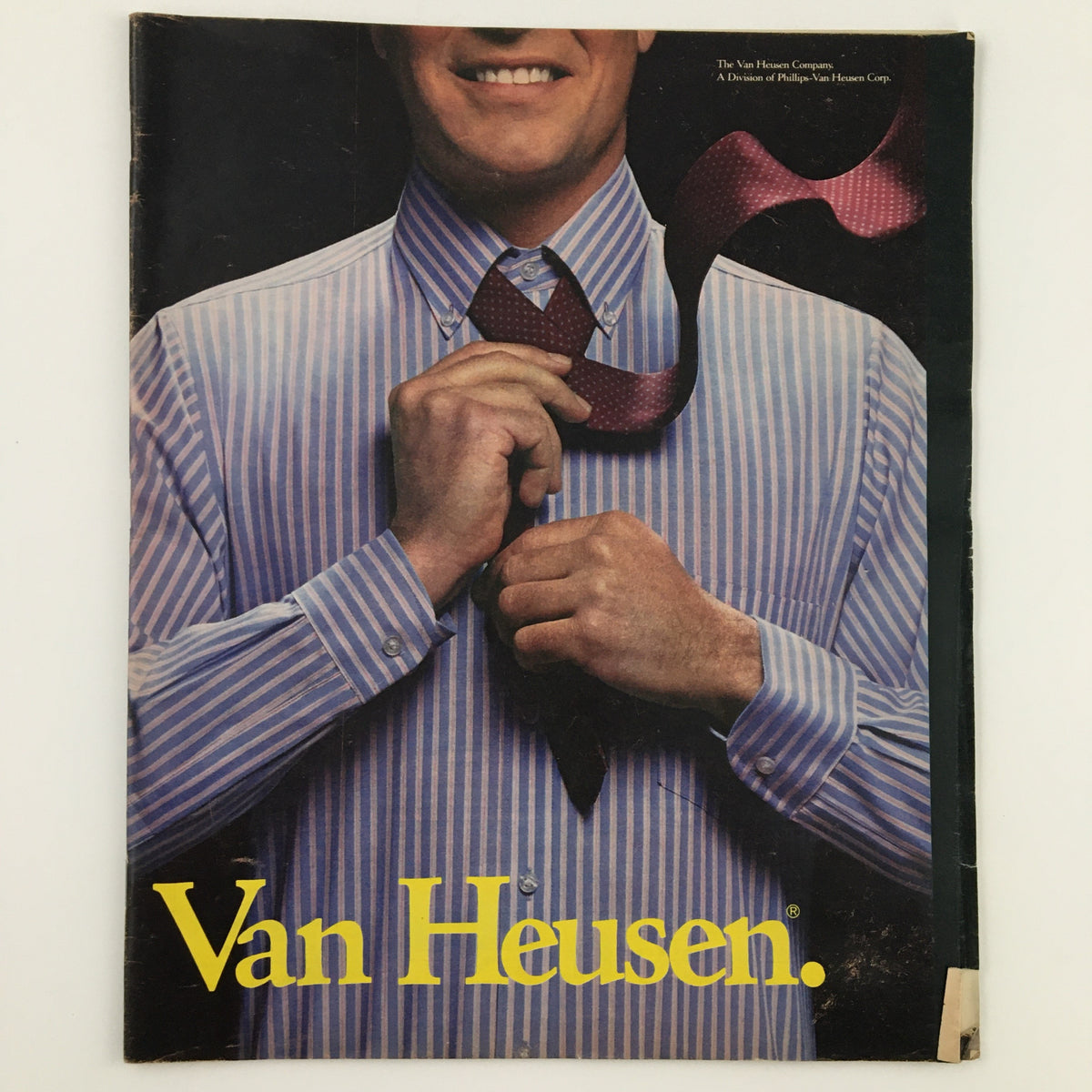 Cover of the New York Times Sports Magazine from March 31, 1985 featuring Van Heusen Company advertisement with a man adjusting his tie, showcasing vintage fashion from the 80s.