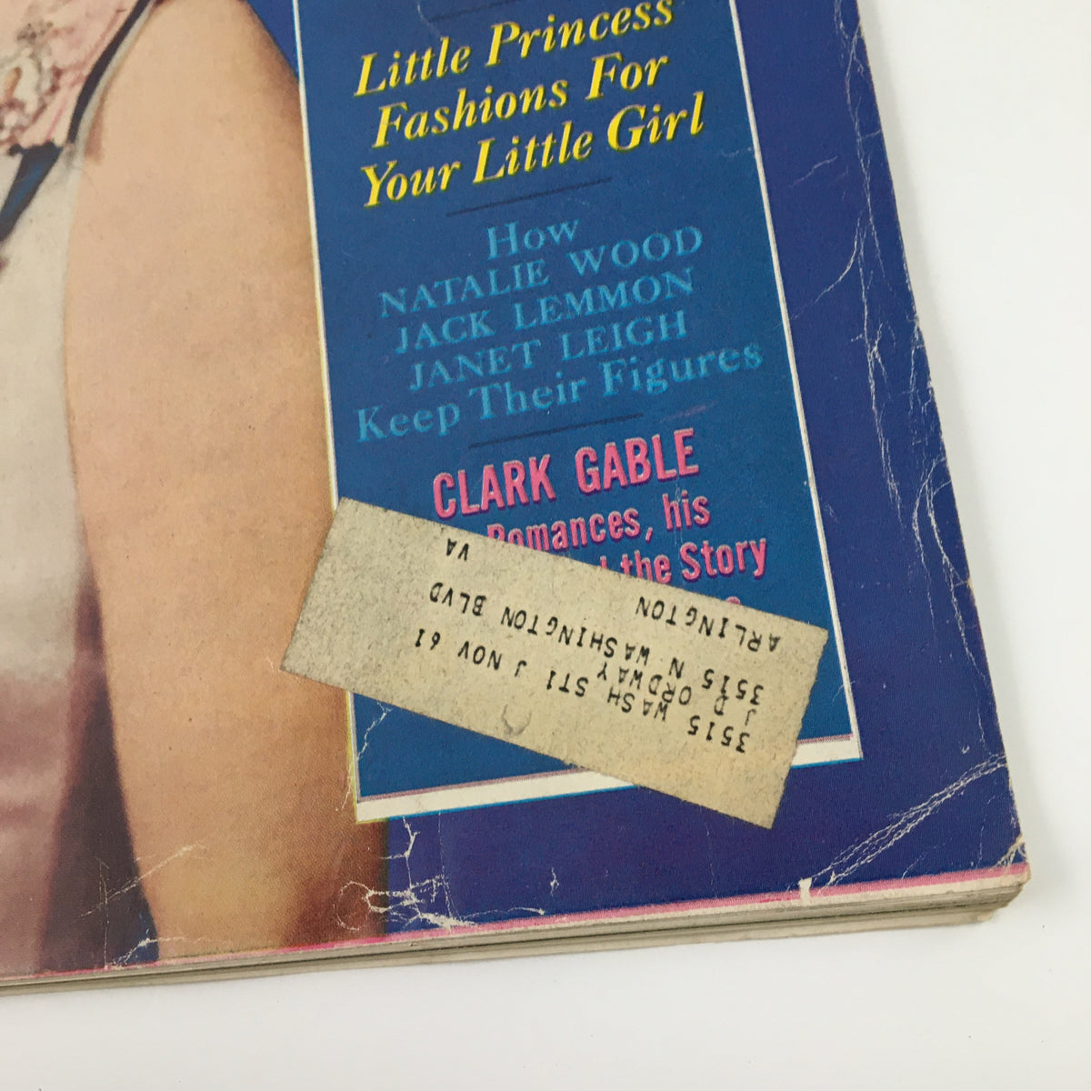 Detail of the corner of the Ladies' Home Journal Magazine July 1961, highlighting advertisements and text, including the title 'The Three Lives of Queen Elizabeth II', and showcasing the magazine's vintage address label.