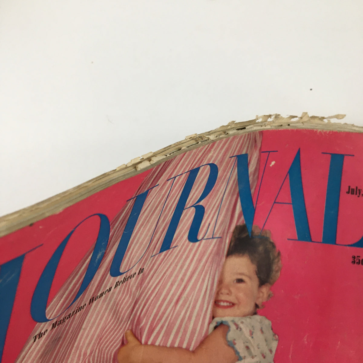 Close-up view of Ladies' Home Journal Magazine July 1954, highlighting wear and tear on the cover with emphasis on Gertrude Lawrence's depiction as Mrs. A.
