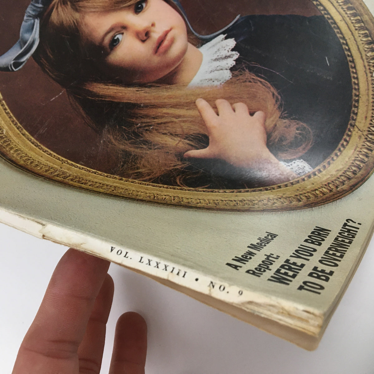 Close-up view of the spine of Ladies' Home Journal Magazine September 1966, highlighting the volume and issue number along with a medical report titled 'Were You Born to be Overweight?'.