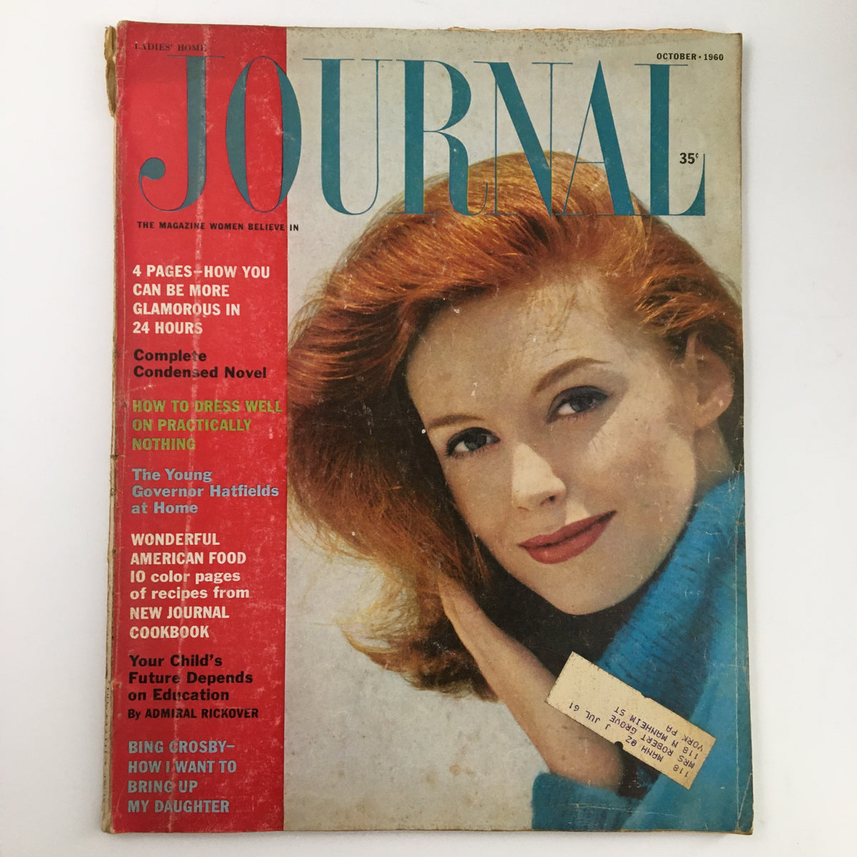 Ladies' Home Journal Magazine October 1960 cover featuring a young woman with red hair and a vibrant smile, alongside text highlighting articles and features such as 'The Young Governor Hatfields at Home'.