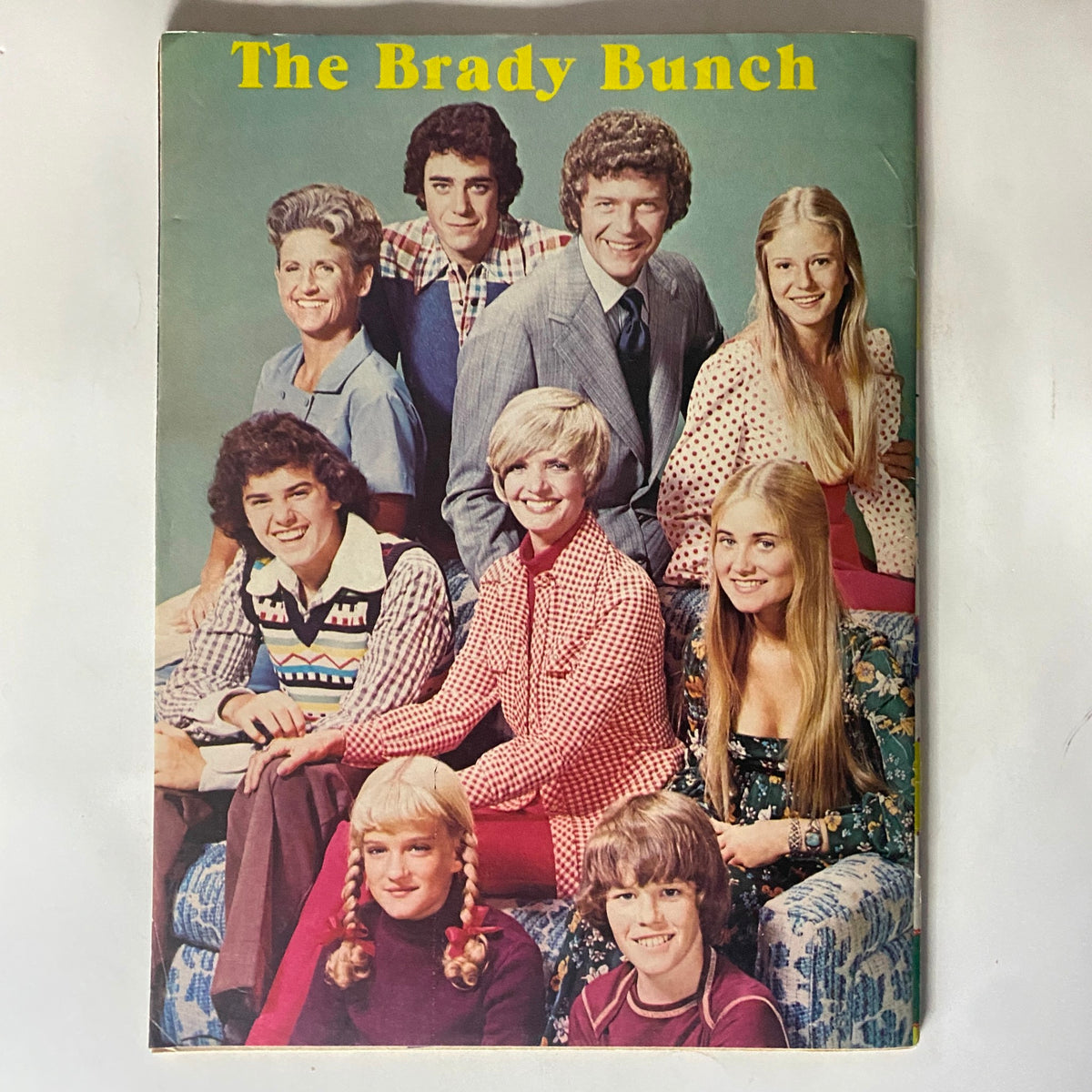 16 SPEC Magazine January 1974 features the beloved cast of The Brady Bunch, capturing the essence of 70s television in a vibrant group photo.