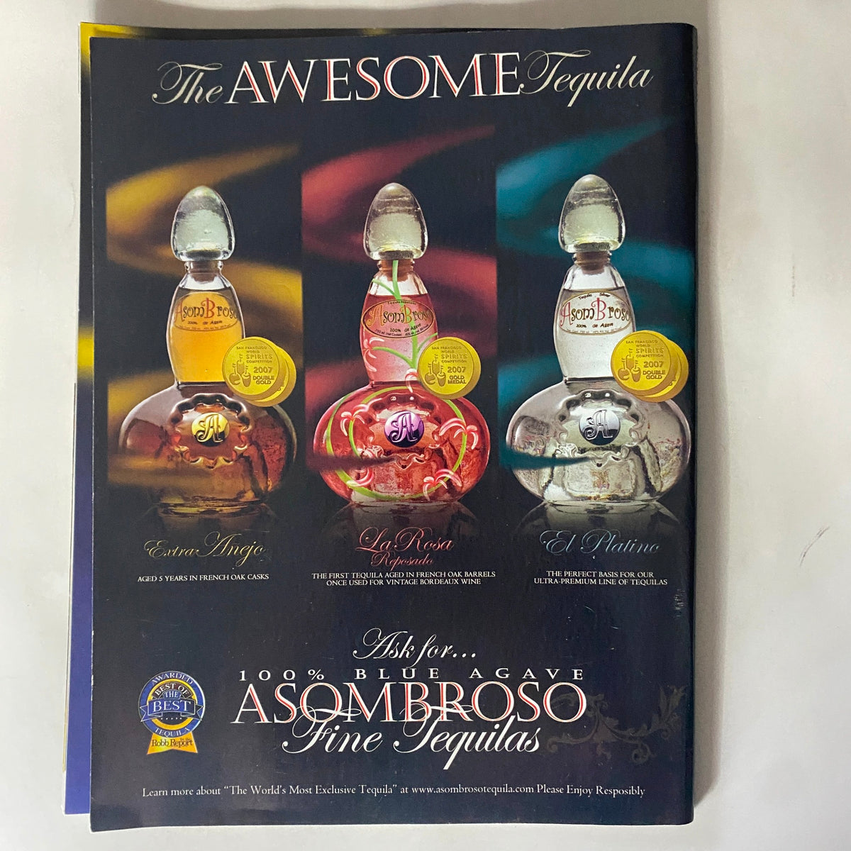 Advertisement for Asombroso fine tequilas featuring three distinct tequilas with elegant packaging, highlighting the brand's premium offerings.
