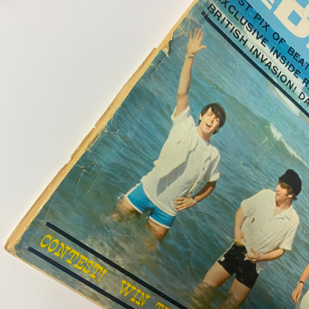 Datebook Magazine Summer 1964 featuring The Beatles on the cover, showing a young man in beachwear at the ocean. A visual representation of Beatlemania during the mid-1960s.