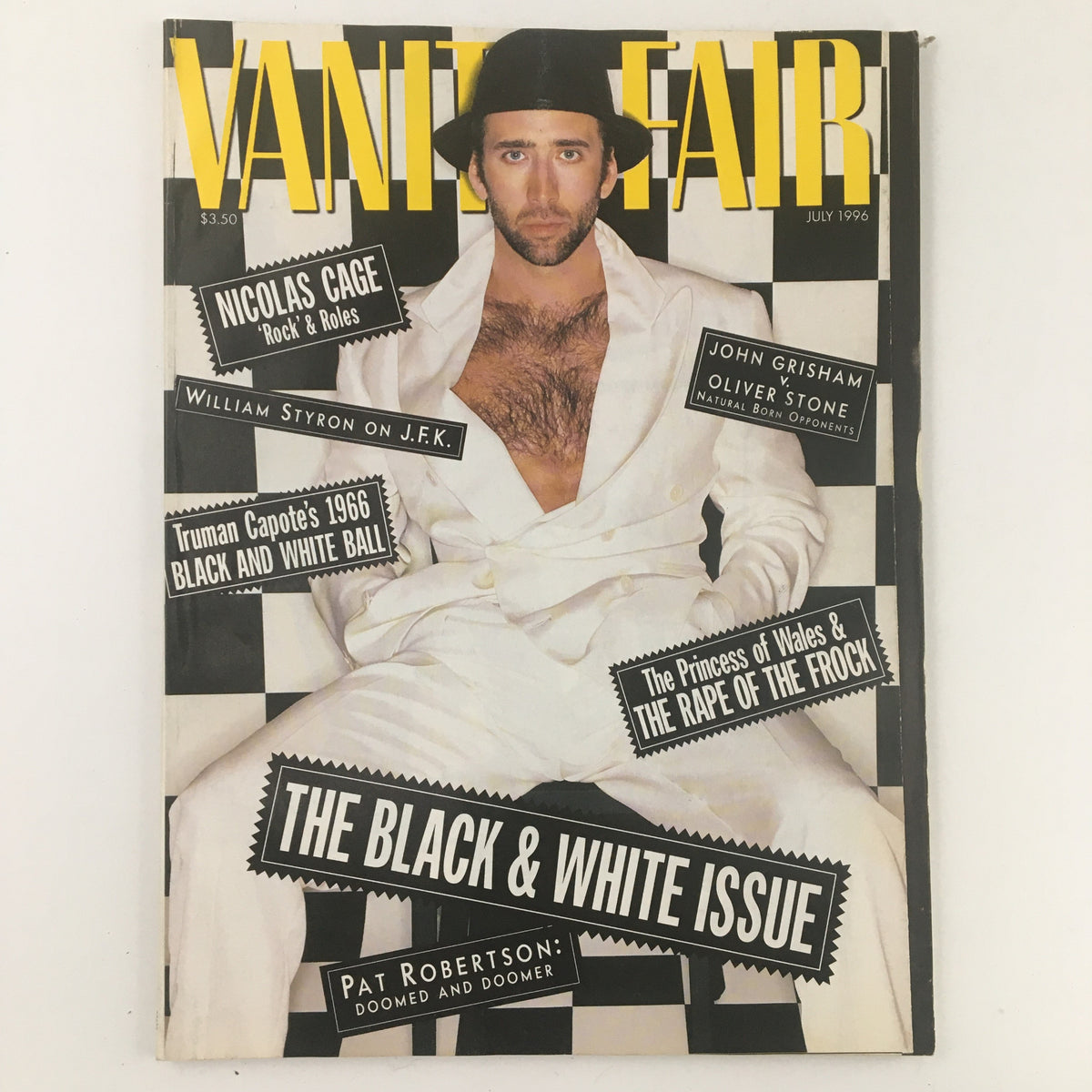 Vanity Fair Magazine July 1996 featuring Nicolas Cage on the cover, showcasing a black and white theme with bold article titles and striking visuals.