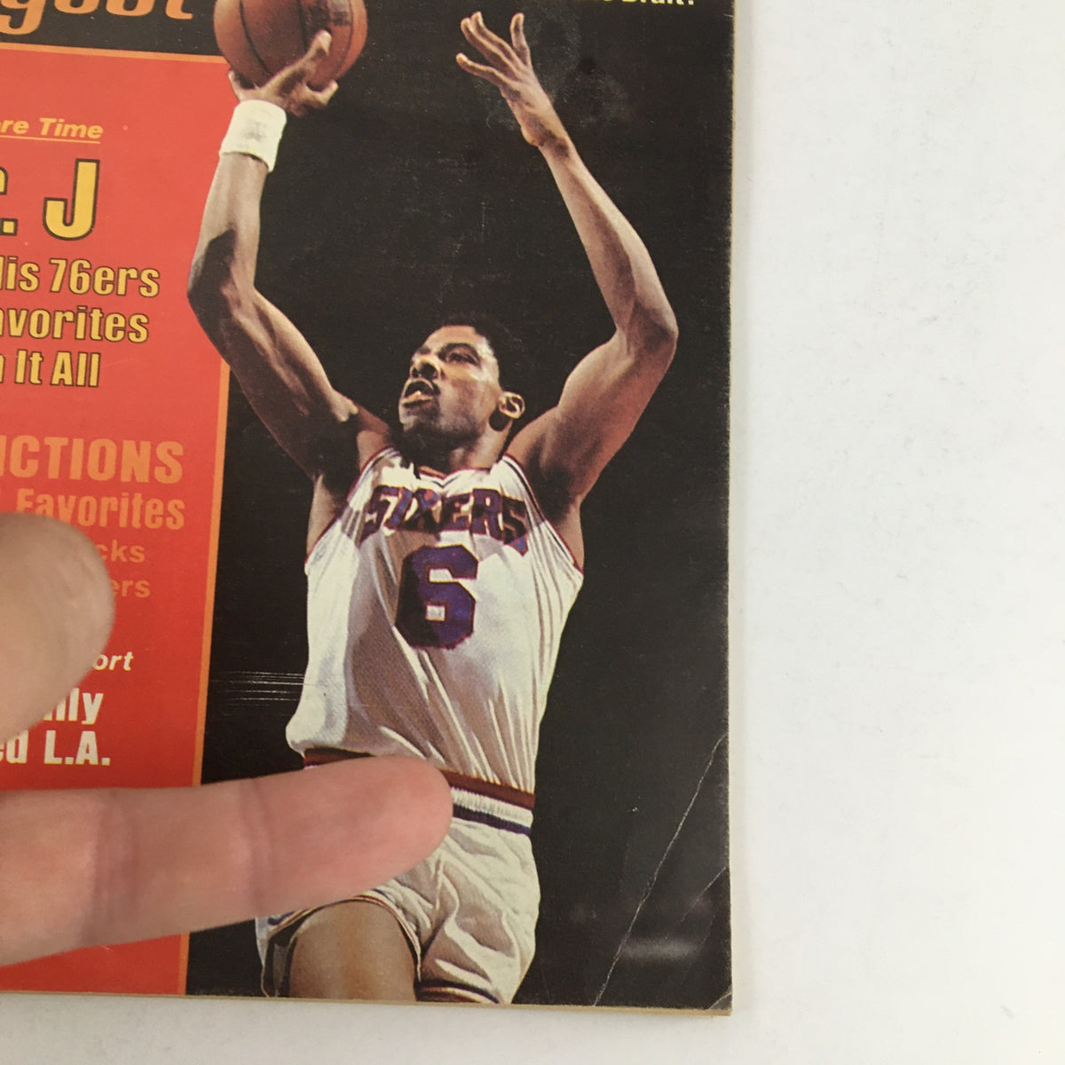 Cover of Basketball Digest Magazine, November 1983 featuring Julius Erving of the Philadelphia 76ers in action, capturing a moment from the NBA season.