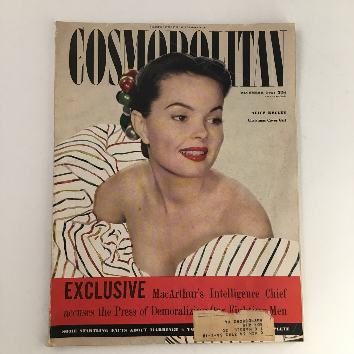 Cover of Cosmopolitan Magazine December 1951 featuring Alice Kelley as the Christmas Cover Girl, showcasing classic 1950s design and style.