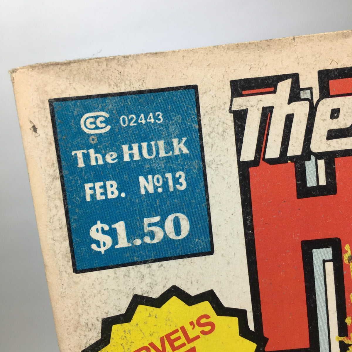 Detail shot of the top corner of The Rampaging Hulk #13 celebrating its February issue number and price of $1.50, highlighting its vintage Marvel magazine status.