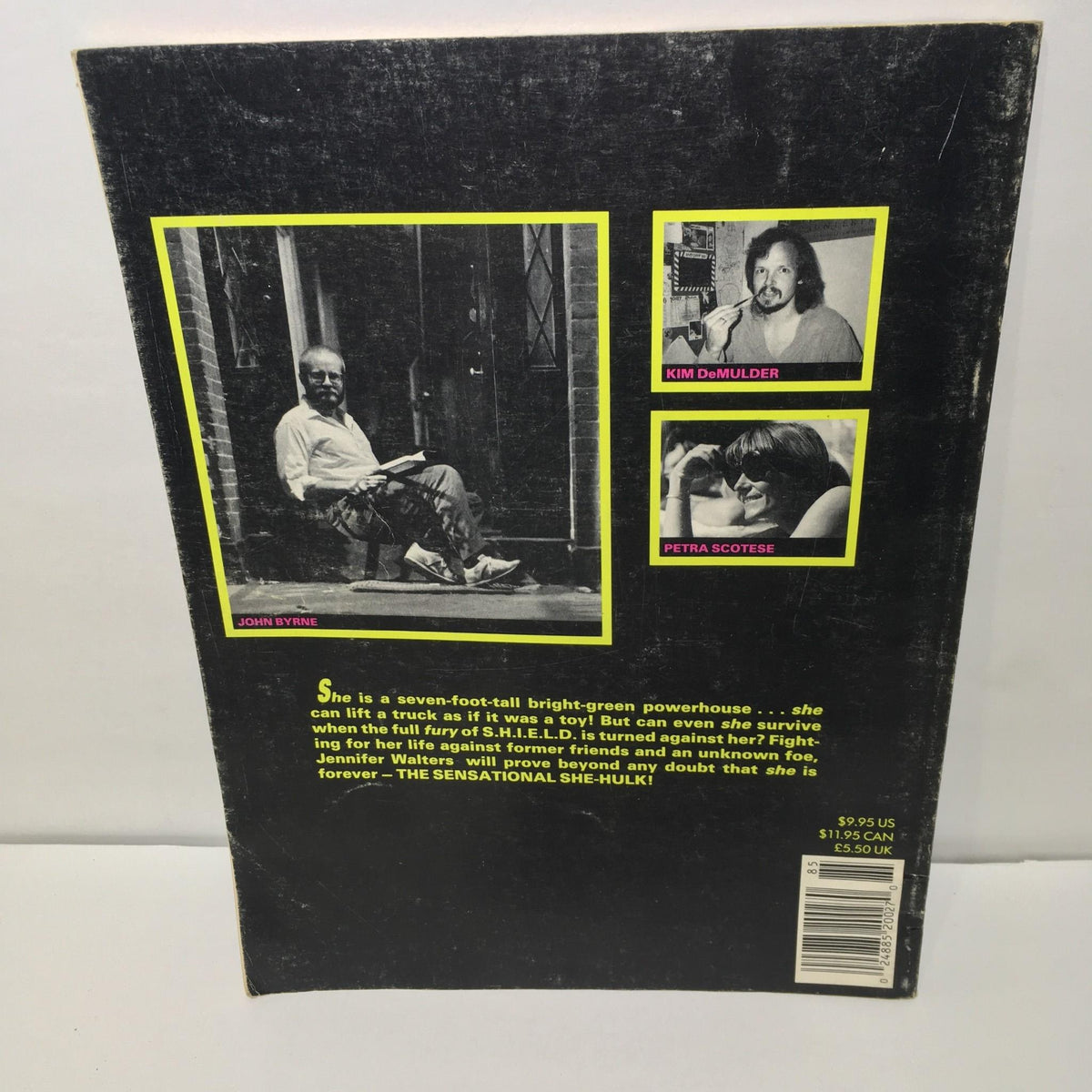Back cover of Stan Lee Presents: The Sensational She-Hulk magazine, featuring a photograph of John Byrne and descriptions of the creative team.