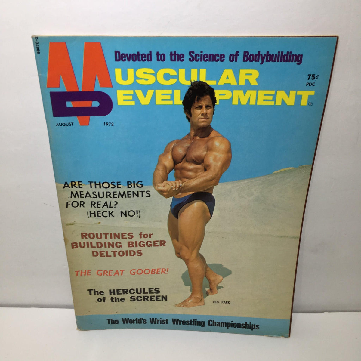 Cover of Muscular Development August 1972 featuring Reg Park, showcasing bodybuilding topics such as bigger deltoids and wrestling championships.