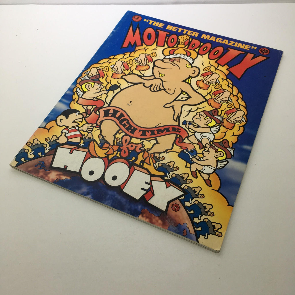 Side view of MotorBooty Music Magazine featuring the title 'High Time for Hooey' surrounded by vibrant illustrations of characters.