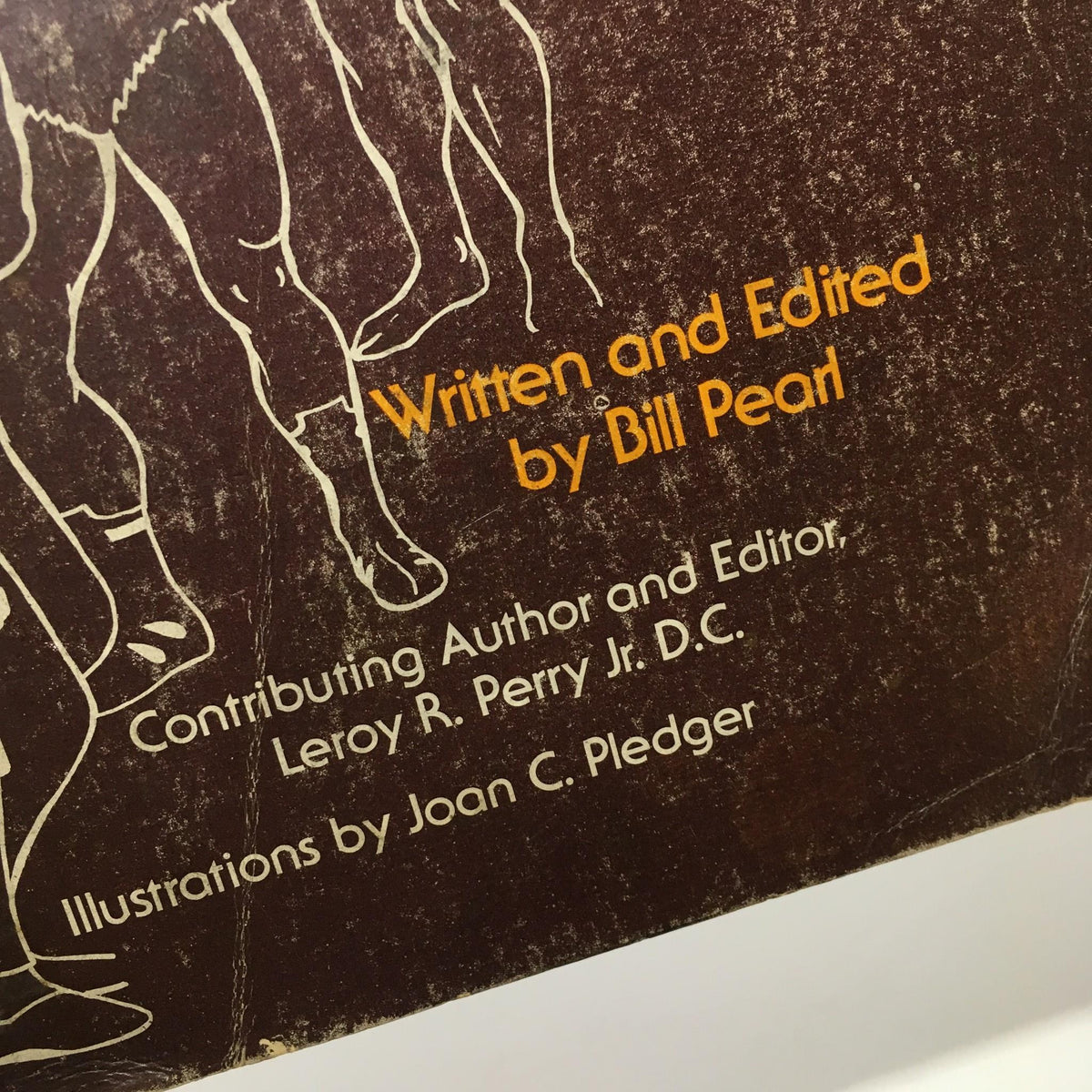 Detail from 'Keys to the Inner Universe Vol. 1 1980 Third Printing by Bill Pearl' showcasing the text 'Written and Edited by Bill Pearl' with additional contributing authors listed.
