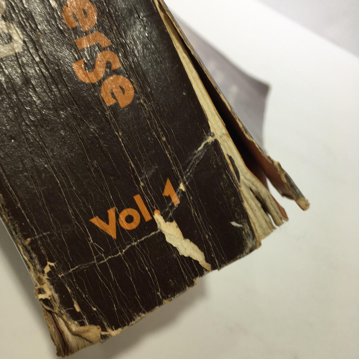 Close-up of the spine of 'Keys to the Inner Universe Vol. 1 1980 Third Printing by Bill Pearl' displaying the volume number 'Vol 1' and signs of wear typical of vintage books.