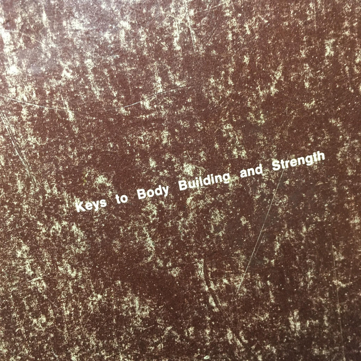 Cover detail of 'Keys to the Inner Universe Vol. 1', highlighting the title and vintage style, showcasing its significance in bodybuilding history.