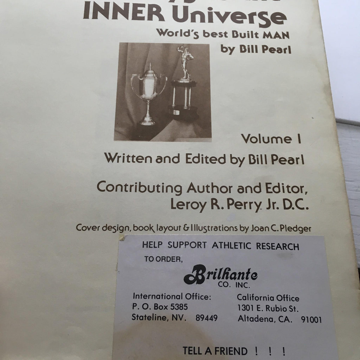 Title page of 'Keys to the Inner Universe Vol. 1' by Bill Pearl, featuring trophies and author details, emphasizing the magazine's historical context in bodybuilding.