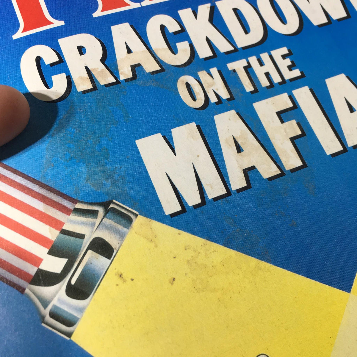 Detailed view of the magazine cover highlighting the title 'Crackdown on the Mafia' from Time Magazine dated October 15, 1984, with visible wear.