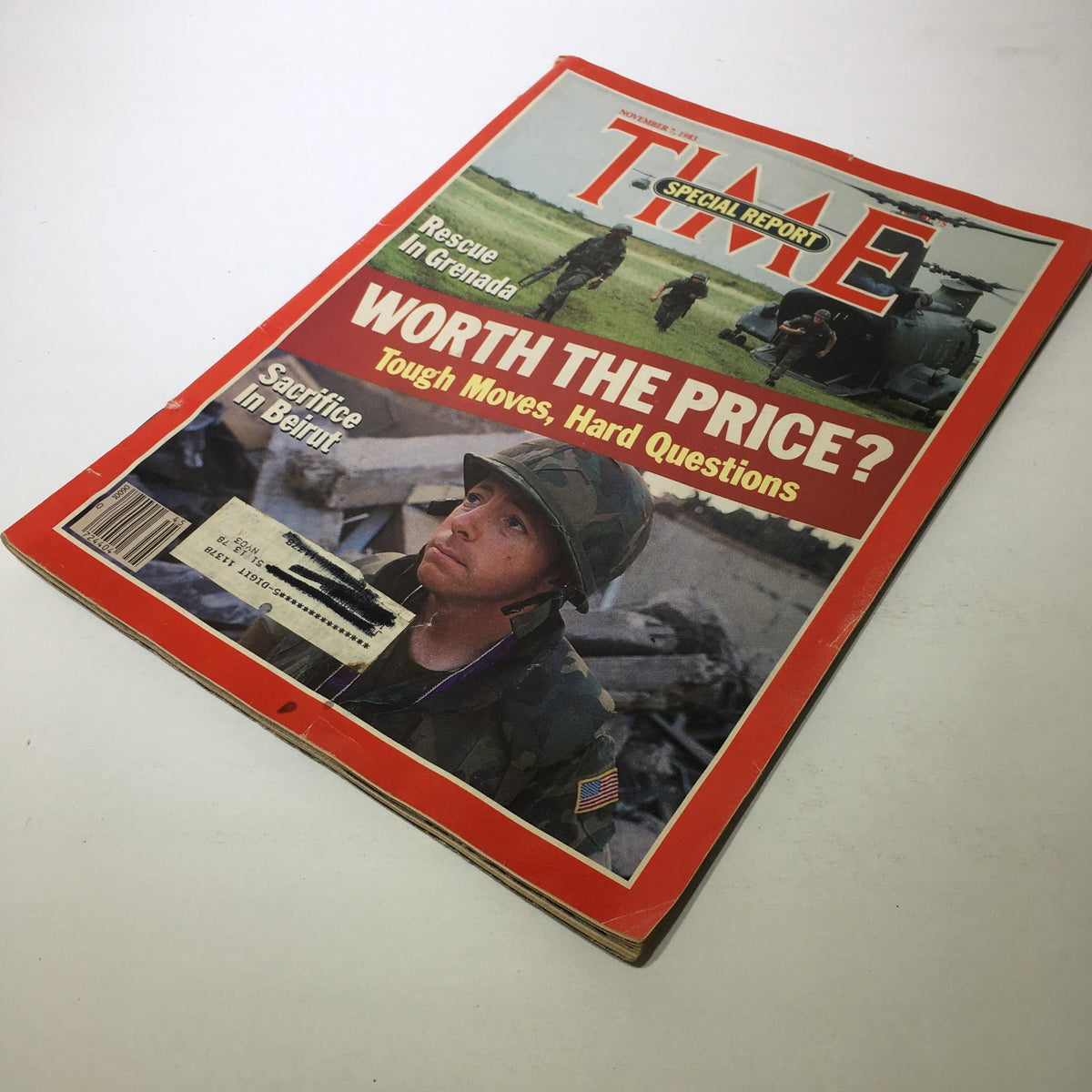 Angled view of the front cover of Time Magazine from November 7, 1983, displaying the title 'Worth The Price?', soldiers, and the tagline 'Tough Moves, Hard Questions'.