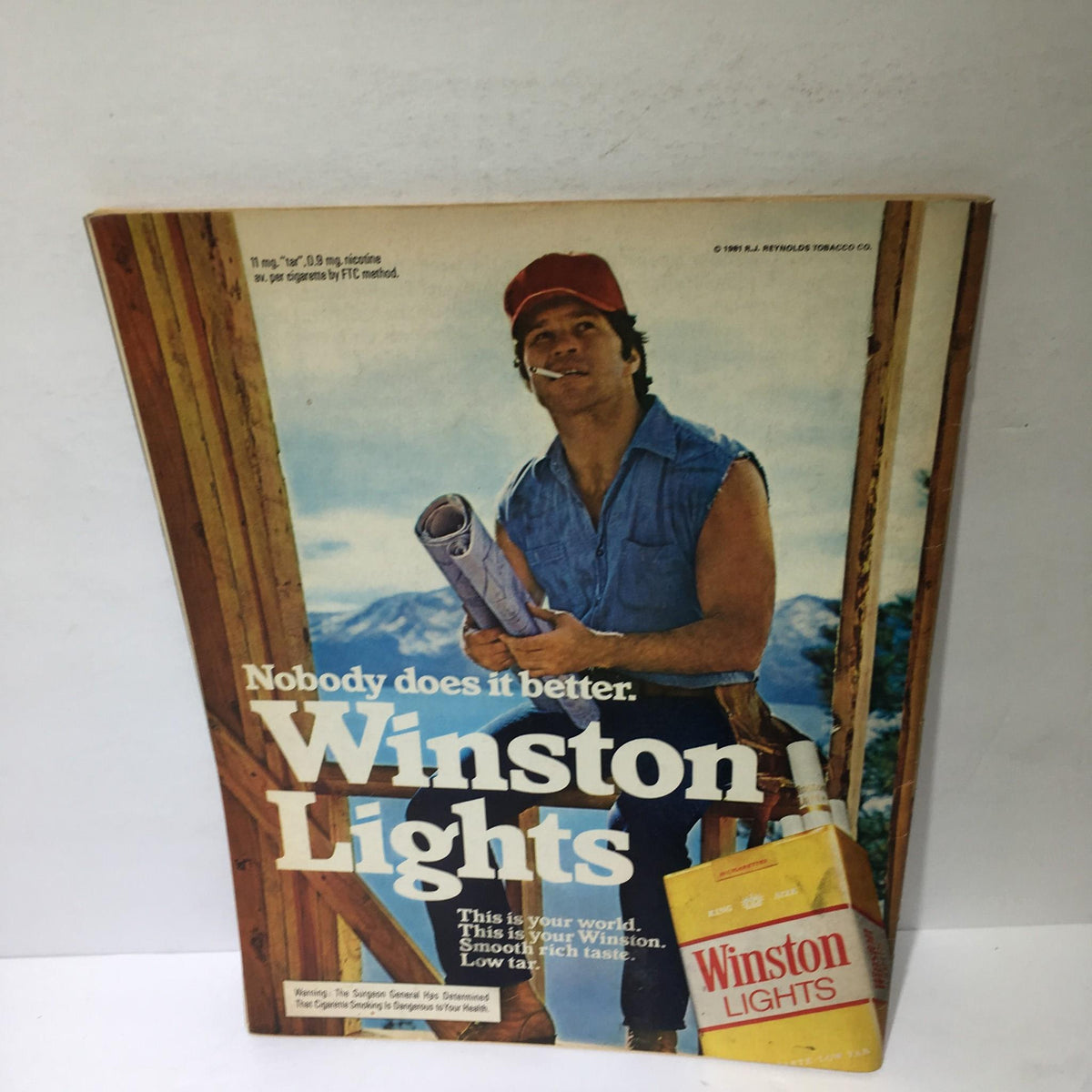 Advertisement for Winston Lights cigarettes from the early 1980s, emphasizing 'Nobody does it better,' featured alongside the Time Magazine June 1, 1981 issue on heart attacks.