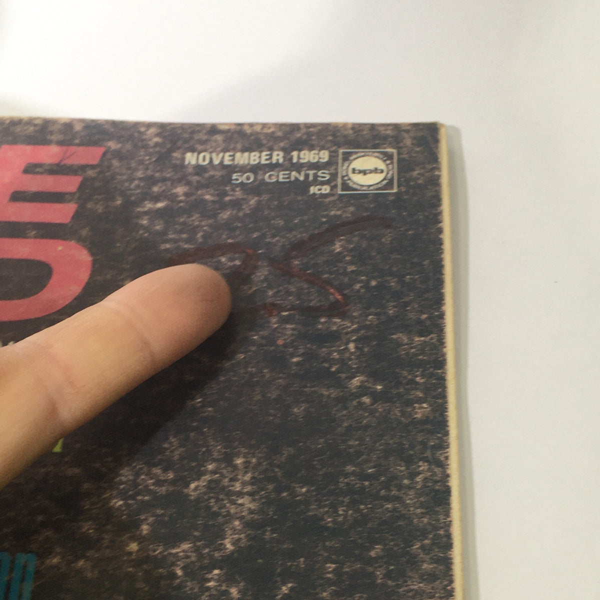 Close-up view of the VTG Cycle World Magazine November 1969 showing the publication date and price, highlighting its collectible nature.