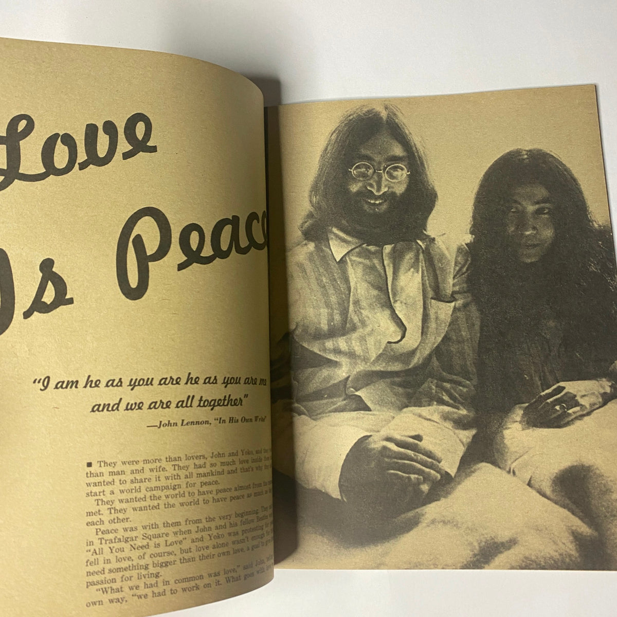 Interior page of 'Beatles Special John Lennon and Yoko Ono Their Love Book Collector's Edition', showcasing a photograph of John Lennon and Yoko Ono with the caption 'Love Is Peace'.