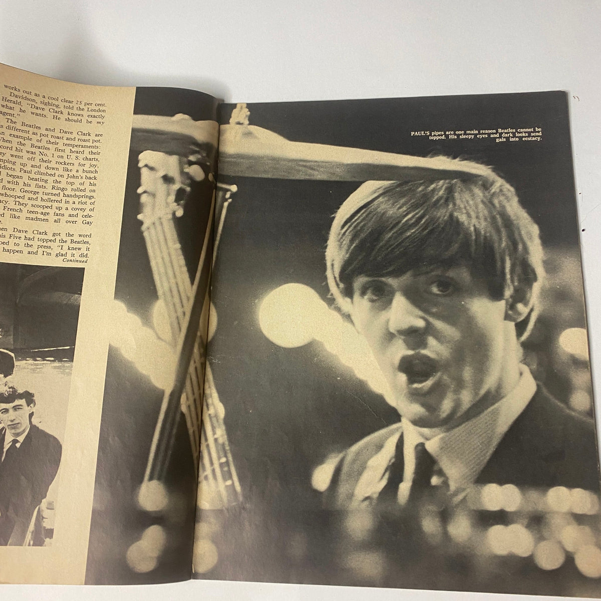 1964 The Original Beatles Book Two and Beatle Romances featuring an intimate shot of Paul McCartney drumming during a performance, capturing the essence of The Beatles' live music experience.