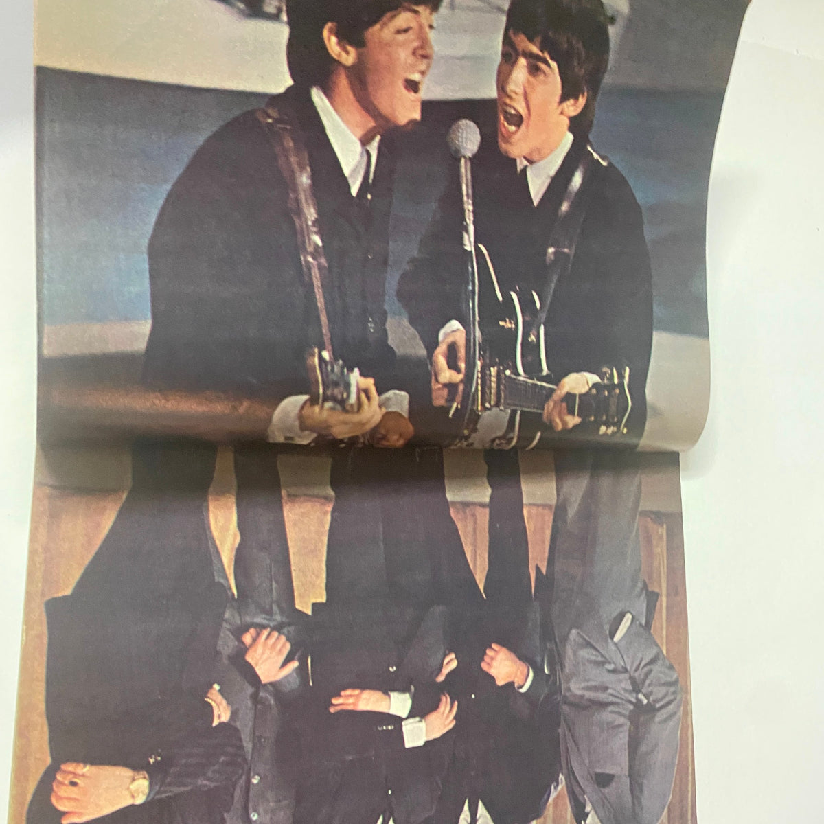Inside spread from Teen Screen Magazine 1964 The Beatles Color Pinup Album showcasing Paul McCartney and Ringo Starr performing, emphasizing the dynamic energy of the Beatles.