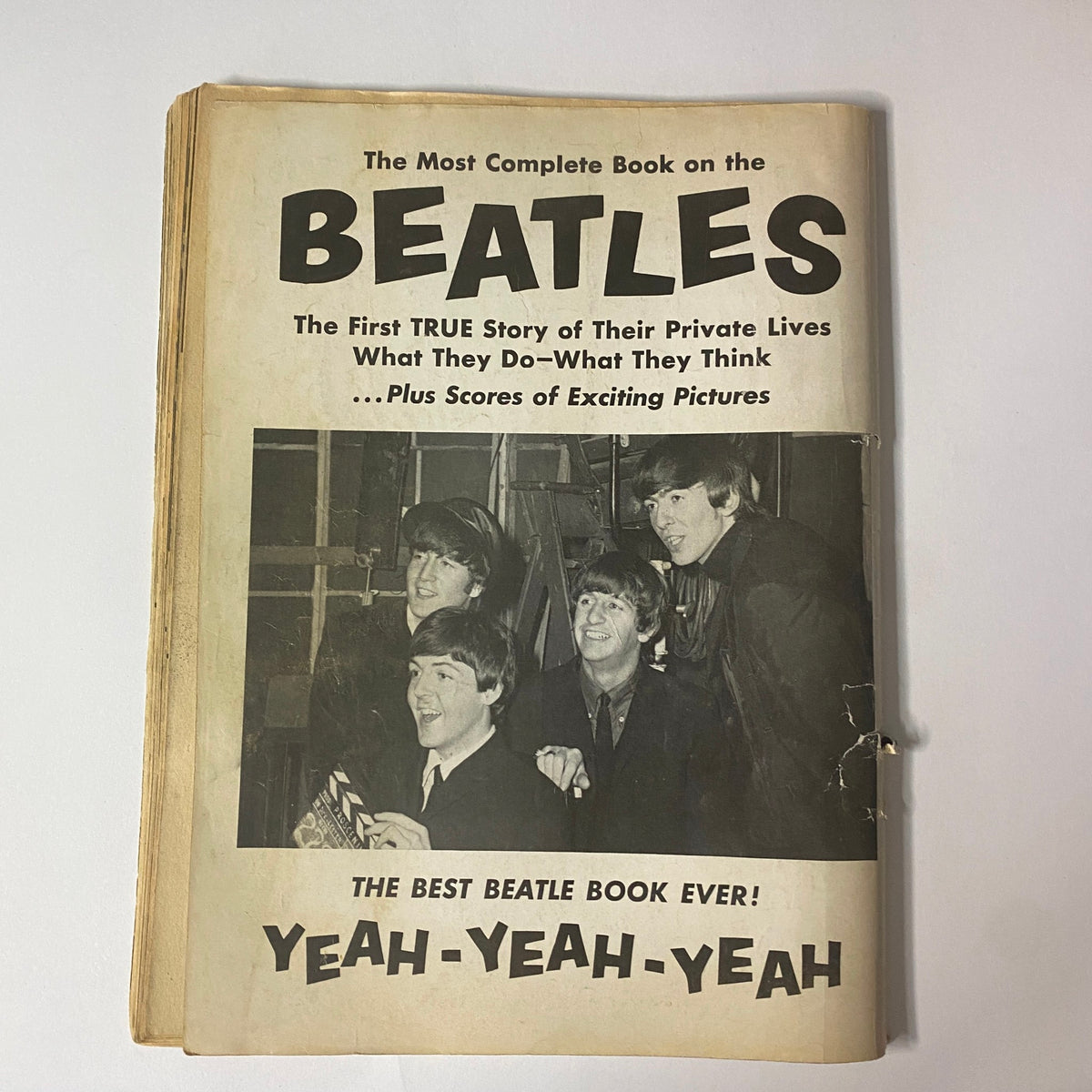 The cover of '1964 The Real True Beatles Number One by Michael Braun,' titled 'The Most Complete Book on the BEATLES,' featuring images of the band and highlighting their private lives with the tagline 'THE BEST BEATLE BOOK EVER! YEAH-YEAH-YEAH'.
