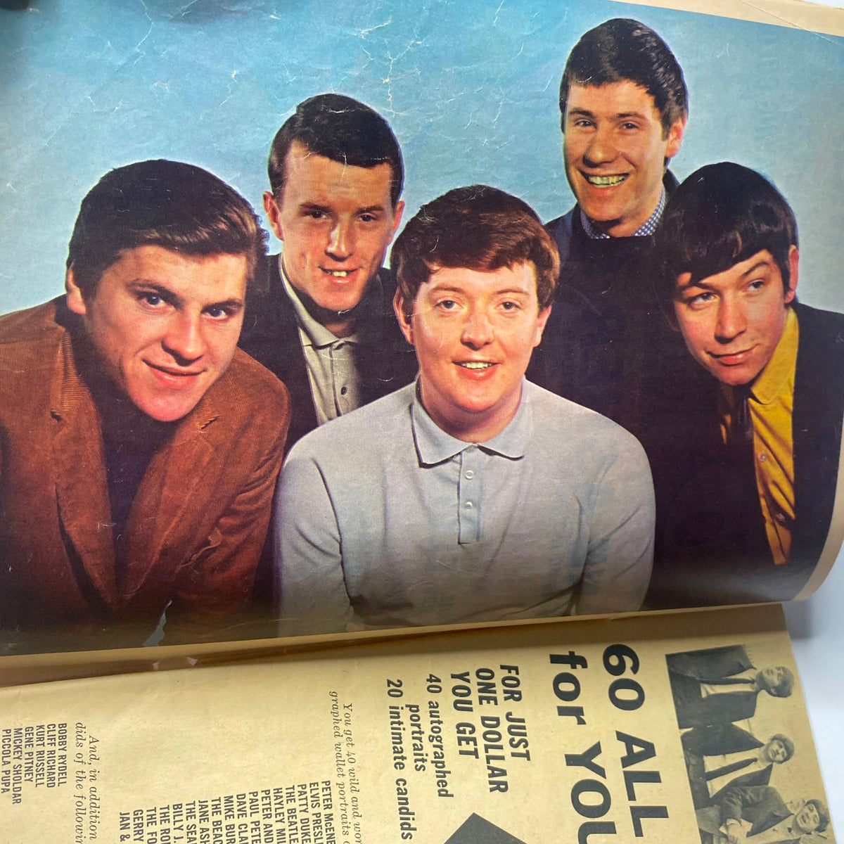 A photo of The Animals, an iconic band featured in 16 Magazine January 1965 Vol 6 No. 8, showcasing the group's members smiling in stylish attire.