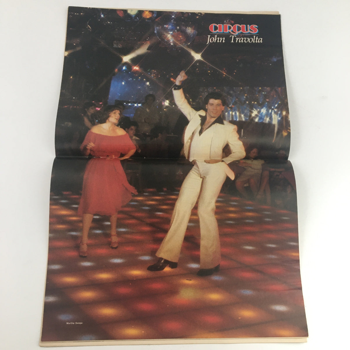 Circus Magazine May 11 1978 poster of John Travolta showcasing his iconic dance move in a disco setting, highlighting his popularity during the late 70s.