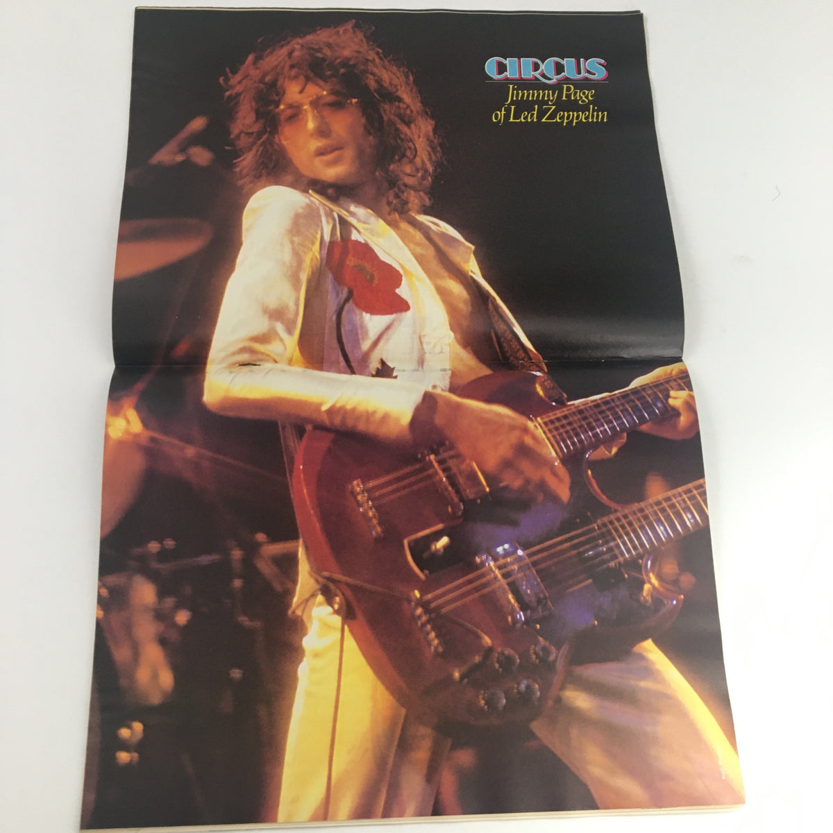 Circus Magazine June 23 1977 poster of Jimmy Page of Led Zeppelin, highlighting the iconic guitarist in stylish attire, a must-have for classic rock fans.