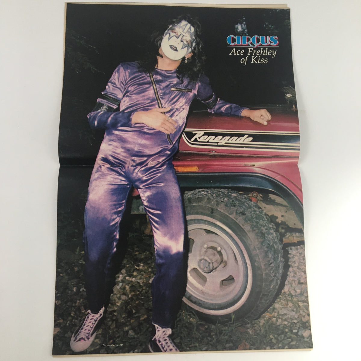 Circus Magazine April 27 1978 featuring Ace Frehley of KISS in a purple outfit, leaning against a Renegade vehicle.