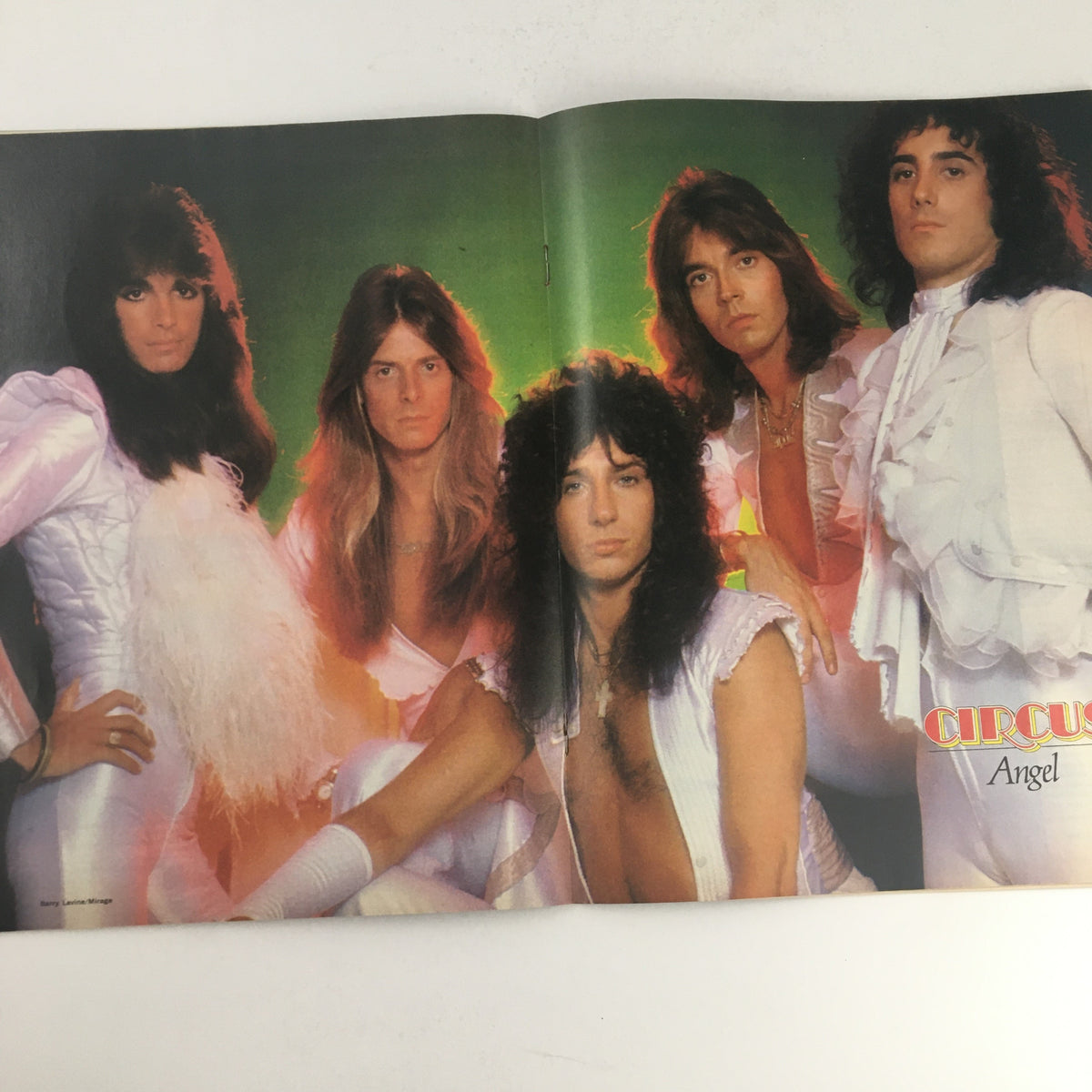 Centerfold spread of the Angel Band in Circus Magazine April 13 1978, highlighting the popular rock band in stylish white outfits.