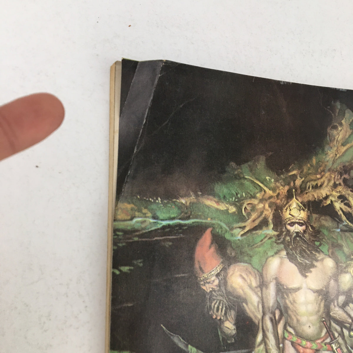 Close-up view of the spine and edge of Heavy Metal Magazine January 1979, showing minor wear and highlighting the unique artwork of the magazine cover.